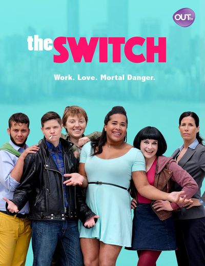 The poster features six jovial people in various colourful clothing nestled tightly into a chaotic lineup and staring into the camera. The person on the left has light brown skin, short dark hair and a dark beard, wears a green scarf, a light lavender dress shirt and bright yellow jeans, and stands with their hands playfully resting on the shoulders of the person next to them. The next person has light skin, short dark hair, wears a black leather jacket and blue jeans, has a cigarette dangling from their mouth, and is shrugging in a defiant manner. The next person over is mostly hidden behind the people to the left and right; they pop their head up over the others' shoulders with a wide grin. They have light skin, short brown-blonde hair and wear an olive-green jacket. The next person over has light brown skin, long dark hair, wears a light blue dress, and shrugs in a welcoming manner with an equally welcoming smile. The next person over has light skin, prominent eye-liner, black hair in a bob cut, wears a denim skirt over red leggings and a purple sweater over a brown leather jacket over a warm pink shirt. Their hands are on their hips, and their smile is widest of the six people. They are also noticeably shorter than the other five. The person farthest to the right has light skin and dark hair, and wears a grey business suit with black pants. Their hands are on their hips, and their expression is extremely neutral compared to the animated expressions of the others. The background is bright blue, with a blurred-out city scape faintly visible. Above the people is the title of the series, "THE SWITCH," with the word "the" in white and the word "switch" in  hot pink. Beneath the title is the tagline, "Work. Love. Mortal Danger."