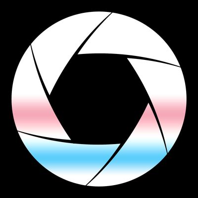 A white camera aperture symbol on a transparent background with gradients of pink and blue to evoke the trans flag.